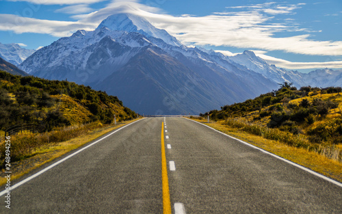 Beautiful Scenic landscape panoramic view of the empty road and the highest mountain of New Zealand - Aoraki/Mount Cook on background. Tourist popuar destination in South Island.