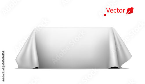 Object covered with white silk cloth. Empty podium or presentation. Secret box, hidden under satin fabric with drapery.