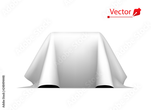Object covered with white silk cloth. Empty podium or presentation. Secret box, cube hidden under satin fabric with drapery.