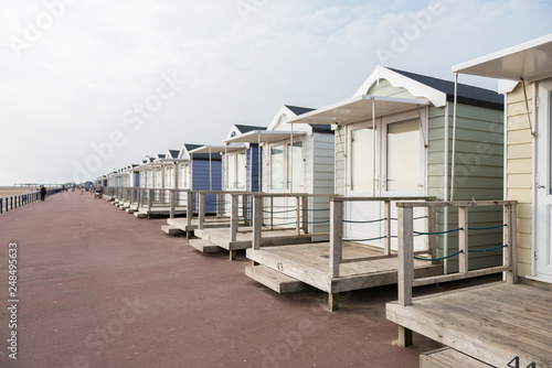 brighton, england, 05/05/2018 Beautiful retro vintage wooden seaside huts on a promenade on the coast. Sunny beach traditional holidays with a neutral pastel colour. Wooden seaside buildings.