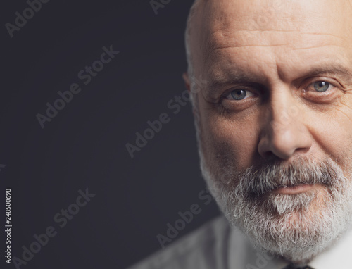 Black and white portrait of a confident mature businessman