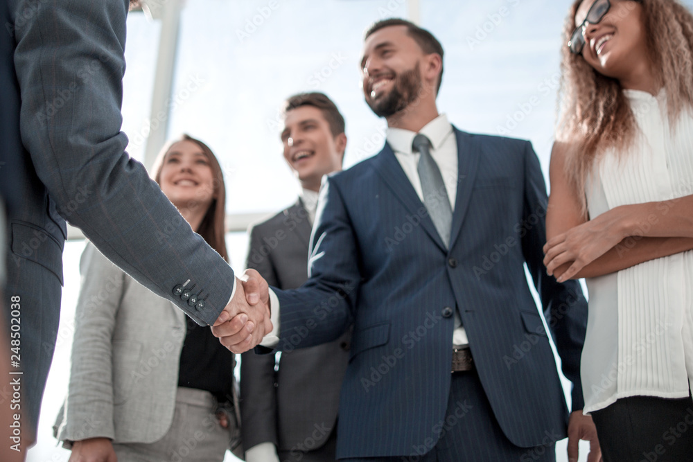business partners greeting each other with a handshake business partners greeting each other with a handshake