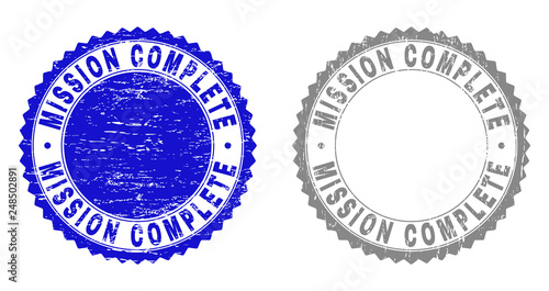 Grunge MISSION COMPLETE stamp seals isolated on a white background. Rosette seals with grunge texture in blue and grey colors.