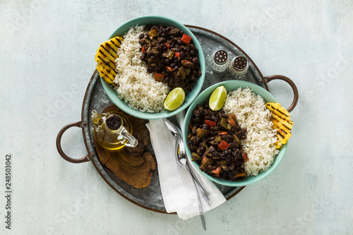 Photography Cuban rice and black bean dish with grilled pineapple