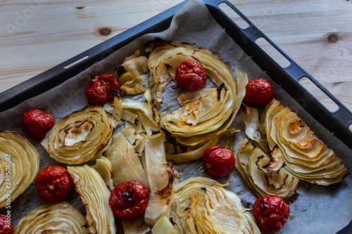 baked white cabbage with tomatoes photo