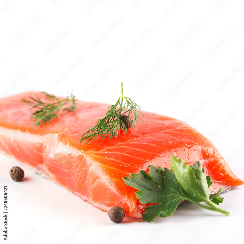 salmon with herbs and spices on white background salmon with herbs and spices on white background