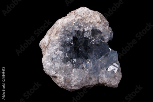 Celestine mineral stone macro on microcline on black background photo