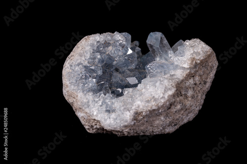 Bild auf Leinwand Celestine mineral stone macro on microcline on black background