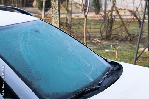 a frozen windscreen of a car one morning photo