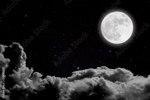 Romantic night. Full moon  over cloudscape background.