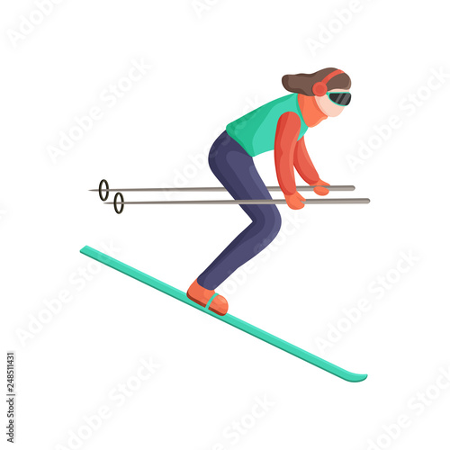 Young woman quickly skiing down the mountain