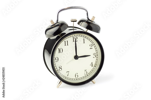 Black alarm clock with two bells on white background