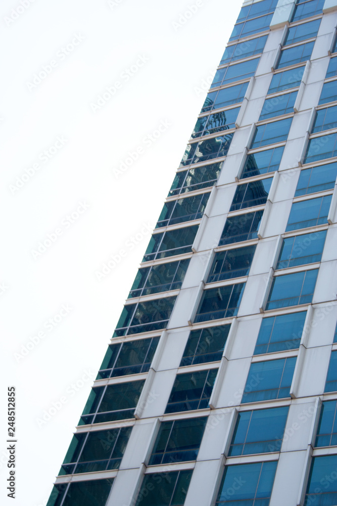 Blue glass building facade detail in Bangkok city, Thailand