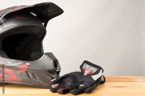 Motorcycle protective gear - motocross helmet and gloves.