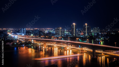 Urban Night Scene Skyline Bright Lights Bridge River Generic City Landscape © hunterbliss