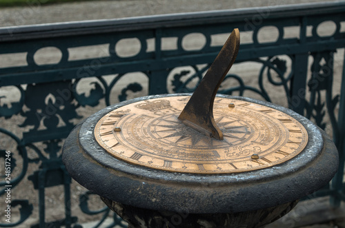 sundial closeup in the winter moist water drops zoomed in