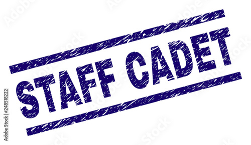 STAFF CADET seal print with grunge style. Blue vector rubber print of STAFF CADET text with grunge texture. Text label is placed between parallel lines.