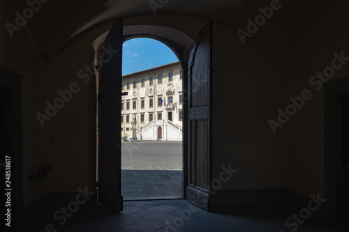 The Piazza dei Cavalieri from the penumbra of the portal, in front of the Palazzo della Corovana, Pisa, Italy © ManryWorld