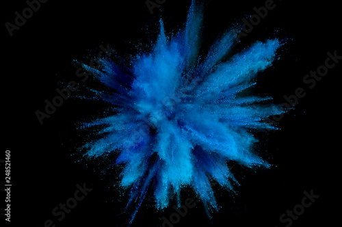 Colored powder explosion. Abstract closeup dust on backdrop. Colorful explode. Paint holi photo