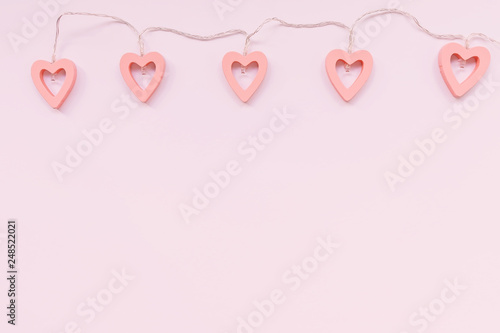 Valentine's Day decoration - heart shaped lights on a pink background
