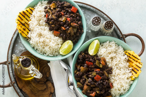 Cuban rice and black bean dish with grilled pineapple. Healthy Vegan Caribbean food for the whole family, party or restaurant menu photo