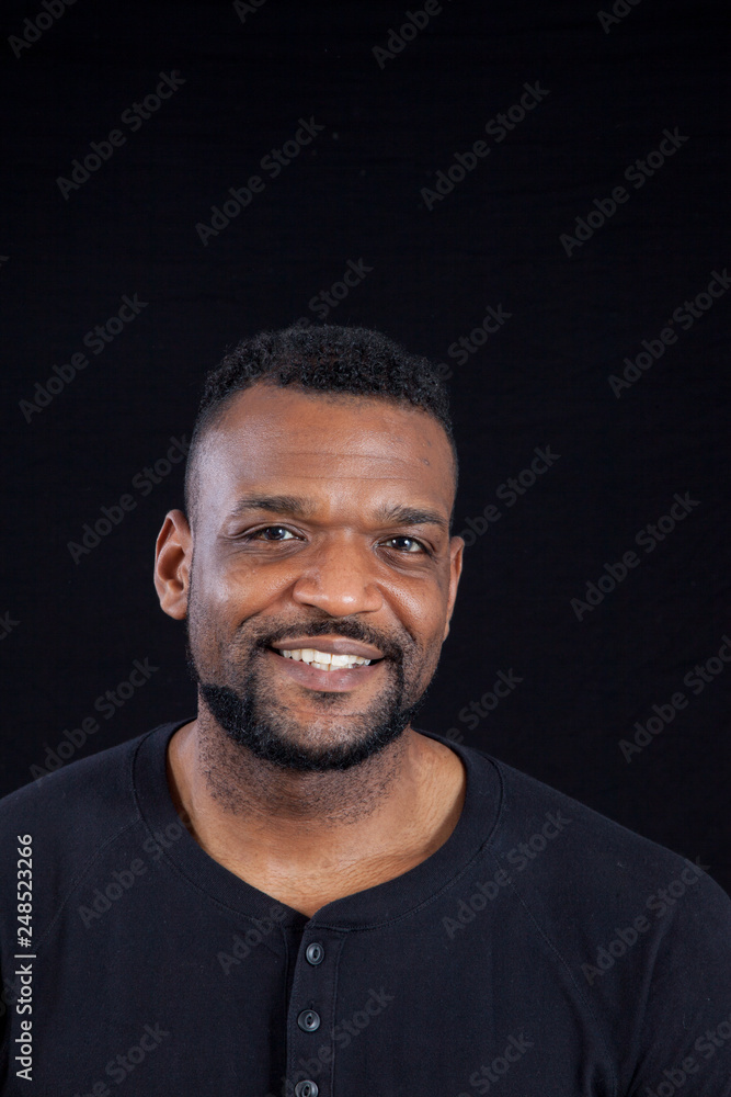 Smiling Black man in black shirt Smiling Black man in black shirt