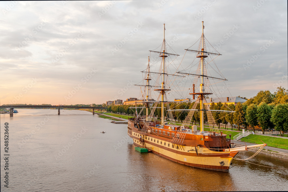 Frigate docked by the embankment of Volkhov river at sunset, Veliky Novgorod, Russia Frigate docked by the embankment of Volkhov river at sunset, Veliky Novgorod, Russia
