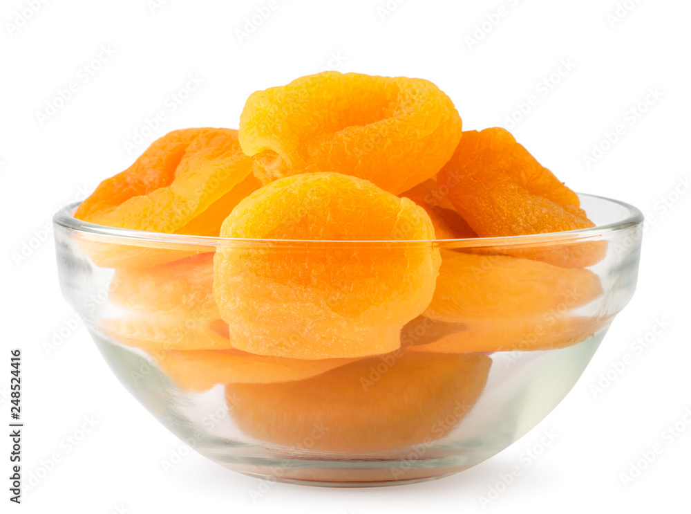 Dried apricots in a glass plate close-up on a white. Isolated. Dried apricots in a glass plate close-up on a white. Isolated.