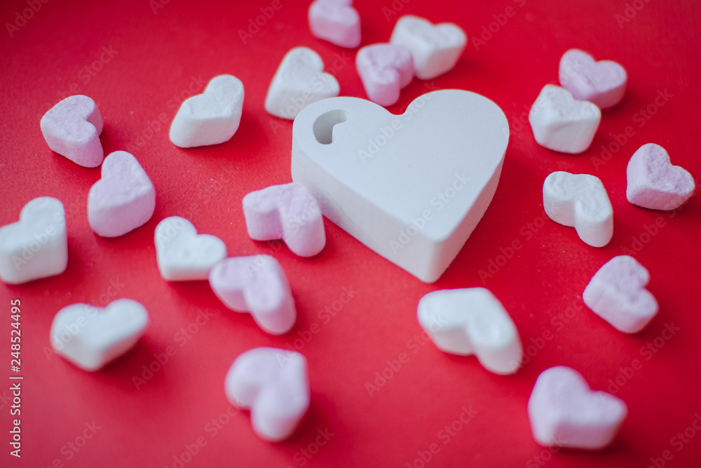 Sweets in the shape of a heart on a red background. Valentine's Day Sweets in the shape of a heart on a red background. Valentine's Day