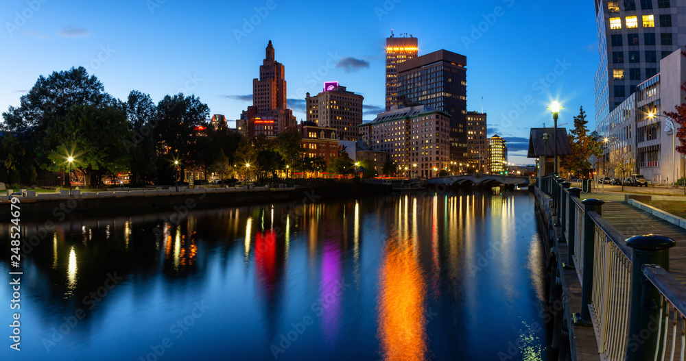Providence, Rhode Island, United States - October 25, 2018: Scenic view of a beautiful modern downtown city during a colorful night after sunset. Providence, Rhode Island, United States - October 25, 2018: Scenic view of a beautiful modern downtown city during a colorful night after sunset.