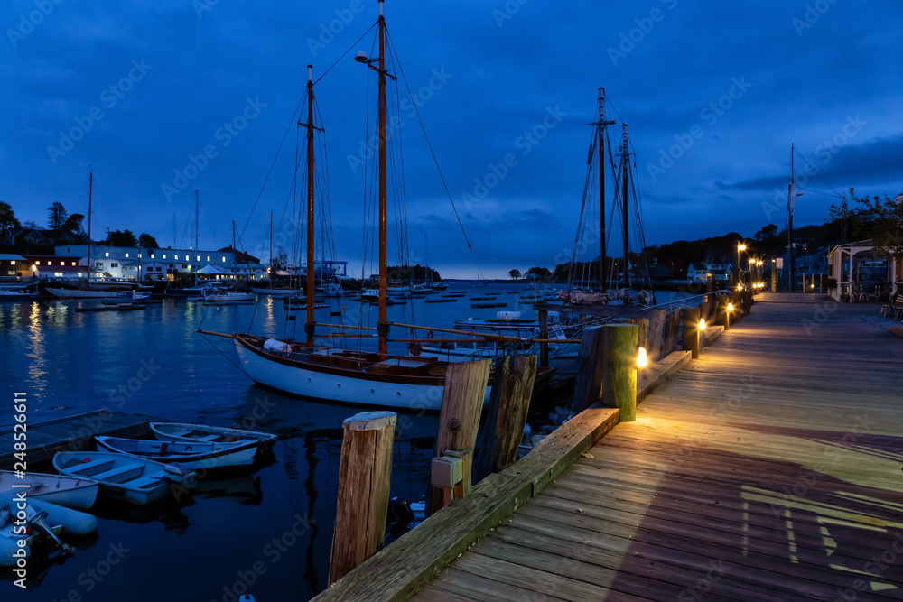 Fototapeta premium Beautiful view on the marina during a cloudy sunrise. Taken in Camden, Maine, United States.