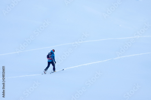 Ski touring in harsh winter condition. Winter alpine landscape