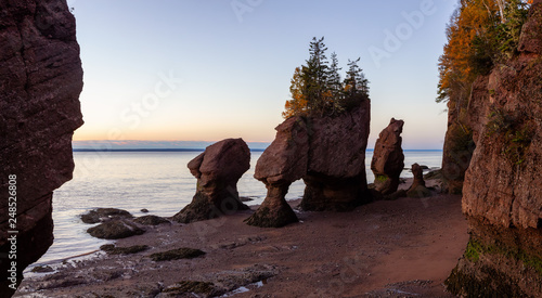 Panoramic view of Cape Rocks during a vibrant sunrise. Taken in Hopewell Rocks Park, New Brunswick, Canada.