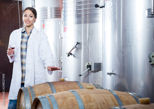 woman in a white coat on the winery