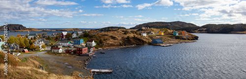 Aerial panoramic view of a small town on the Atlantic Ocean Coast during a sunny day. Taken in Trinity, Newfoundland and Labrador, Canada. photo