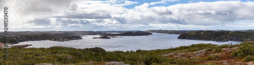 Panoramic View of a Canadian Landscape on the Atlantic Ocean Coast during a cloudy morning. Taken in Pikes Arm, Newfoundland and Labrador, Canada.