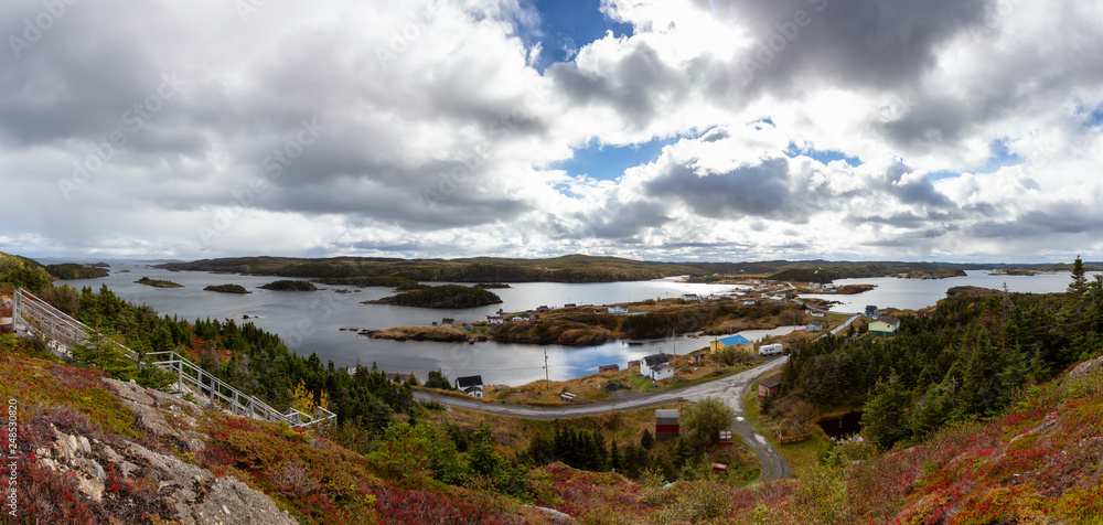 View of a small town on the Atlantic Ocean Coast during a cloudy evening. Taken in Pikes Arm, Newfoundland and Labrador, Canada.