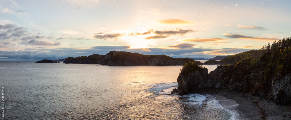 Obraz premium Striking panoramic landscape view of a rocky Atlantic Ocean Coast during a vibrant sunrise. Taken at Beachside, Newfoundland and Labrador, Canada.