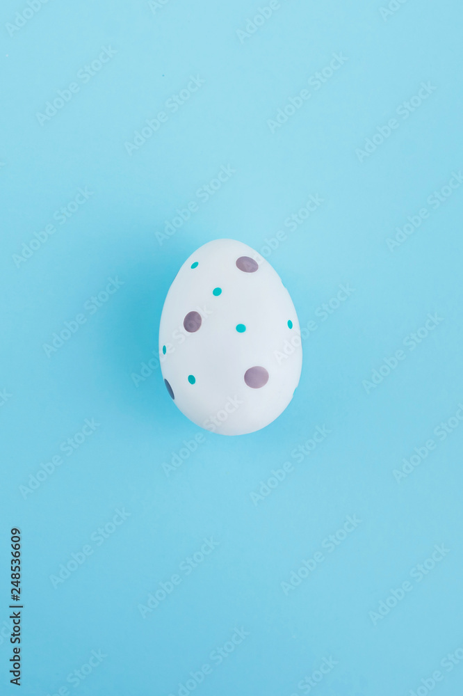 Egg decorated with flowers on wooden background, Easter concept.