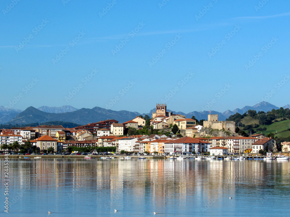 San Vicente de la Barquera reflected in water, coastal village in Cantabria, Nothern Spain