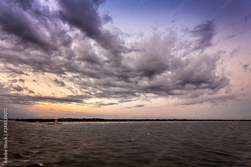 Panorama of Punta Sabbioni lighthouse in the Venice lagoonduring a thunderstorm