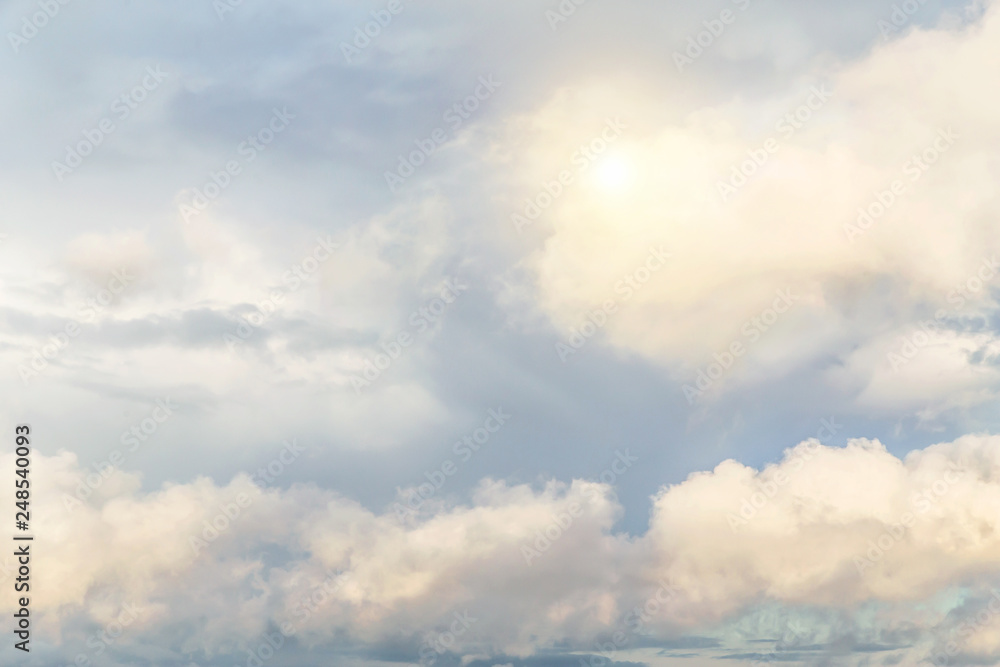 Cumulus fluffy clouds, sky with sun background texture, epic dramatic heaven Cumulus fluffy clouds, sky with sun background texture, epic dramatic heaven