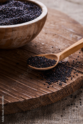 bowl with raw black quinoa 