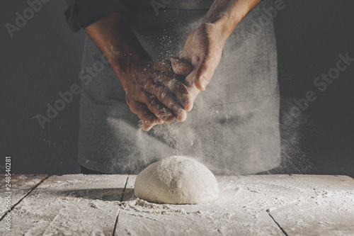 Photographie Chef making and kneading fresh dough
