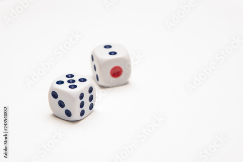 Two playing dice on a white background in the studio