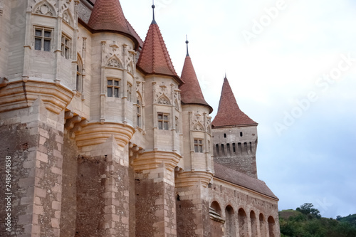 Wall with towers of the medieval castle of Corvin, Romania. photo