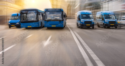 buses move along a multi-lane avenue