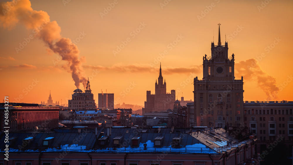 Obraz premium Moscow, Russia Sunset Orange Sky Calm Winter Landscape Towers Old Architecture Travel Location Smoke Stack European