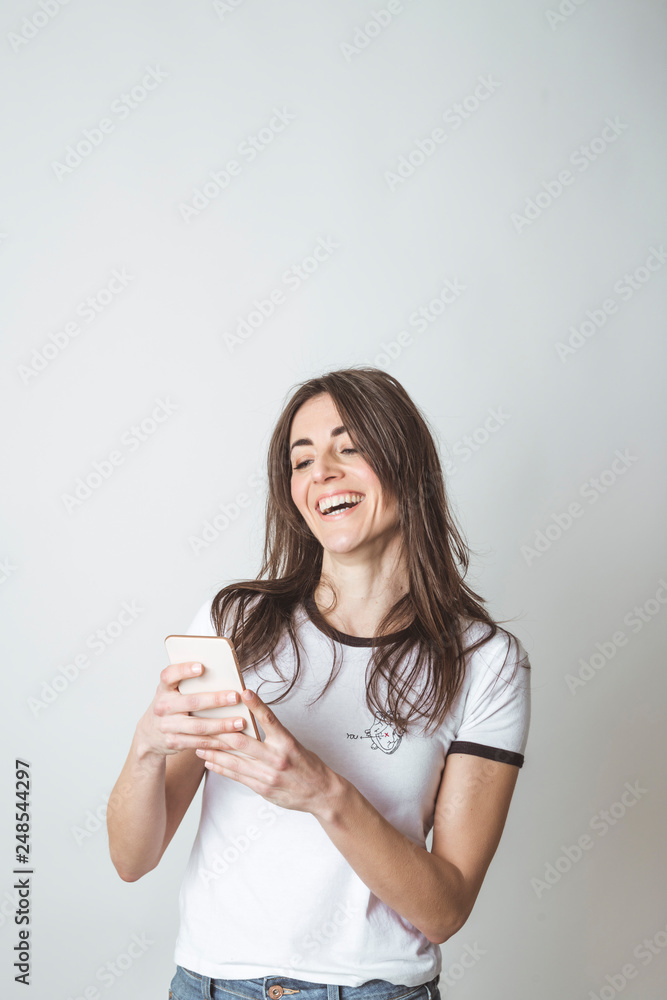 Beautiful woman using mobile in white background Beautiful woman using mobile in white background