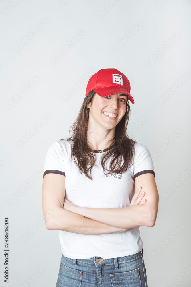 Happy beautiful woman with red hat in studio Happy beautiful woman with red hat in studio
